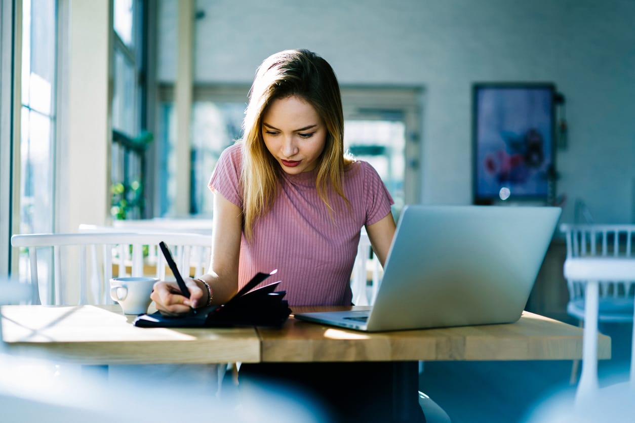 woman working at desk on laptop
